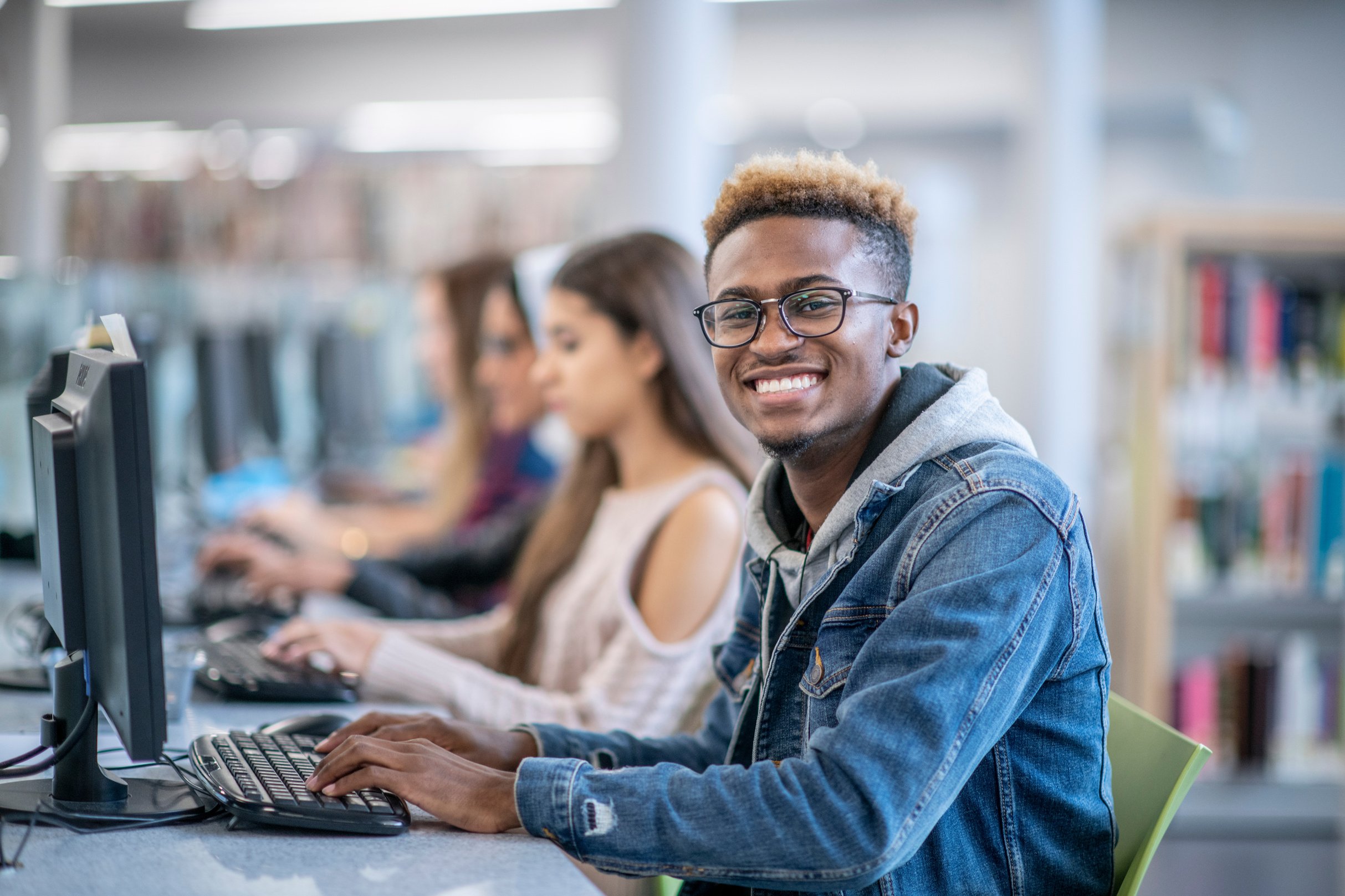 Smiling student on computer